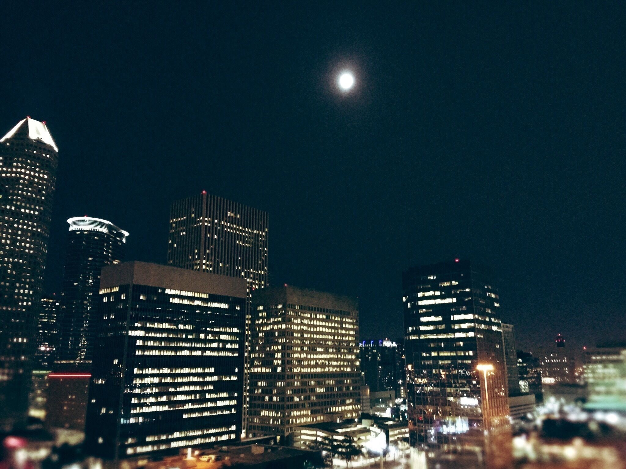 Sitting by the rooftop pool, gazing at the moon in midtown Houston. Winter time is when Houston really shines. It is a season characterized by bright clear days and brisk moonlit nights. It's a city that gets a lot of precipitation, but when the clouds part it can be truly magnificent. I often say "If the weather was like this year-round, we couldn't afford to live here".