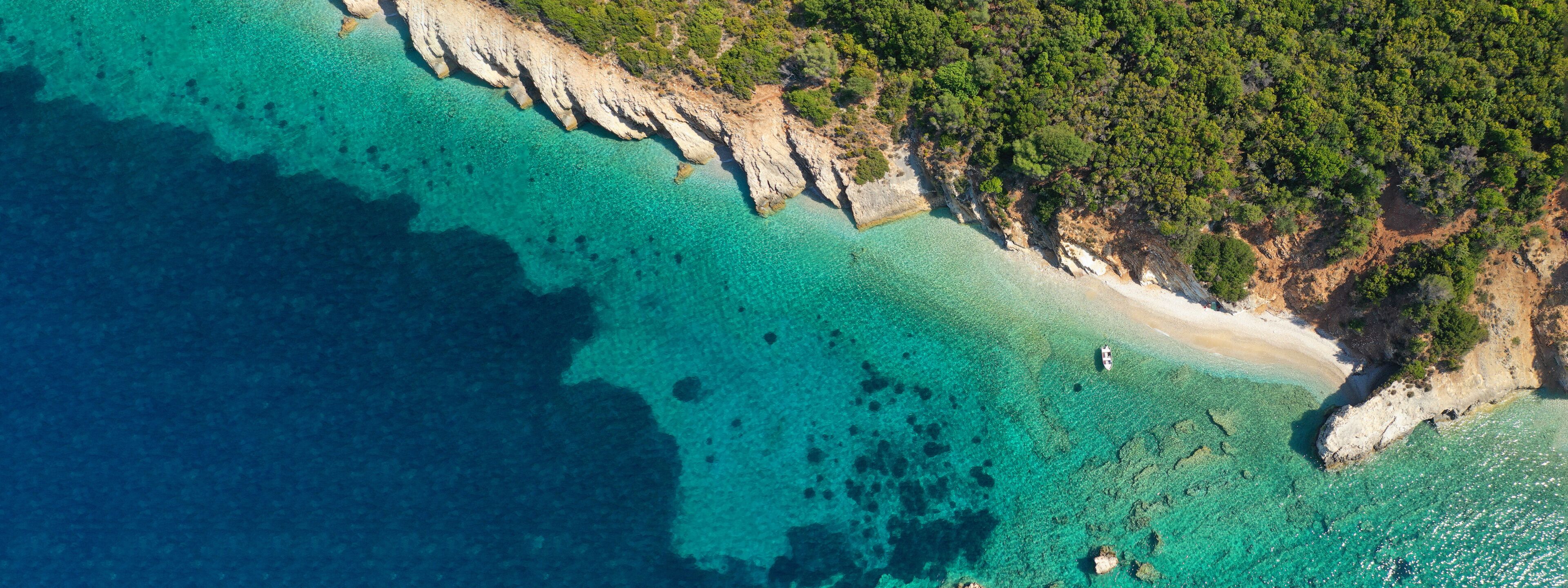 Aerial drone ultra wide panoramic photo of tropical exotic emerald sea wit turquoise crystal clear waters in asian destination island