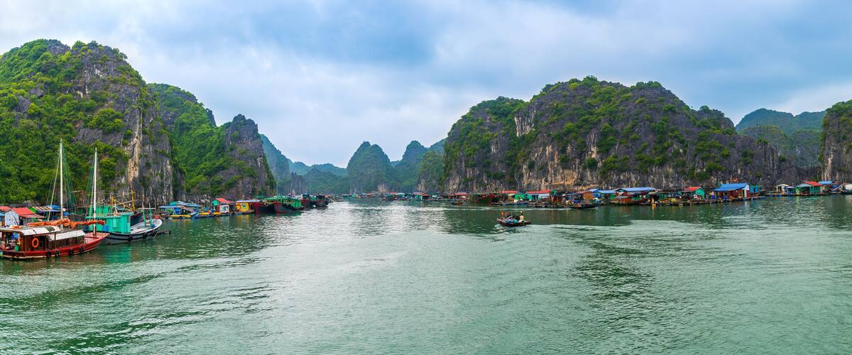 Panorama of LAN HA Bay destination beach and Island with touring floating fishing village the UNESCO World Heritage Site