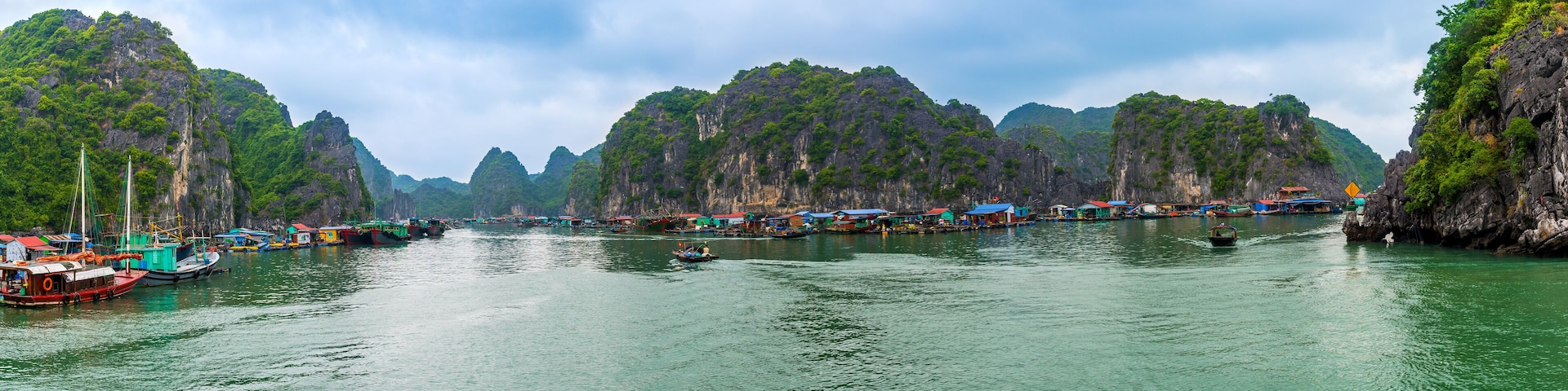 Panorama of LAN HA Bay destination beach and Island with touring floating fishing village the UNESCO World Heritage Site