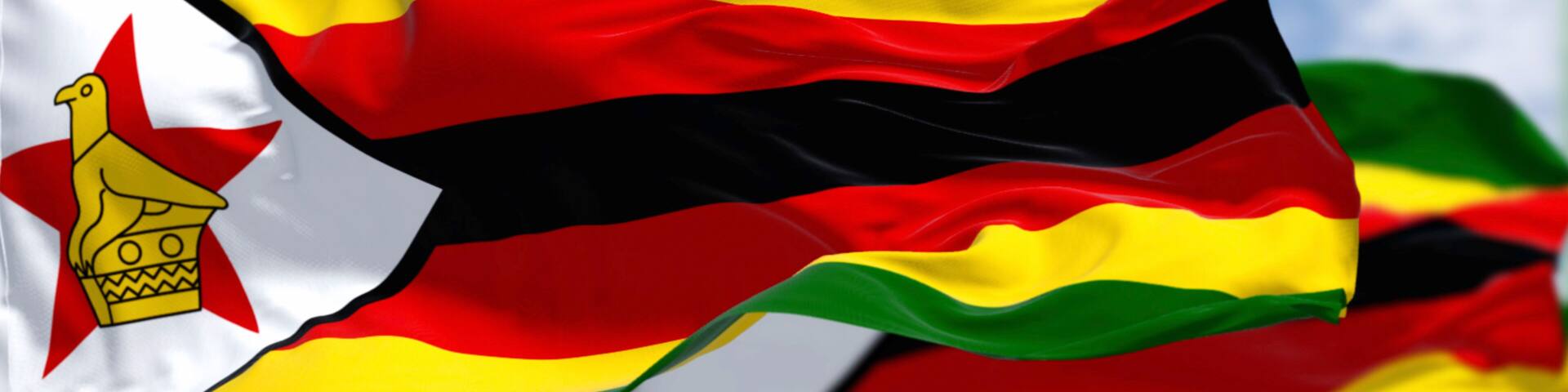 Close-up view of the Zimbabwe national flags waving in the wind