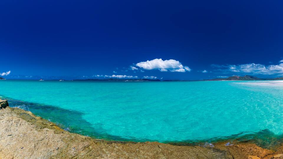 Panorama of Whitehaven Beach with white sand in the Whitsunday Islands, Queensland, Australia