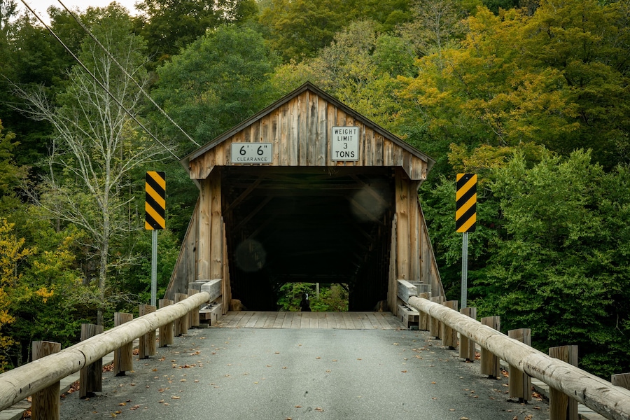 Roscoe, NY - USA - Sept 17, 2022 Horizontal view of the entrance to the Beaverkill Covered Bridge, also known as the Conklin Bridge, a wooden covered bridge over the Beaver Kill.