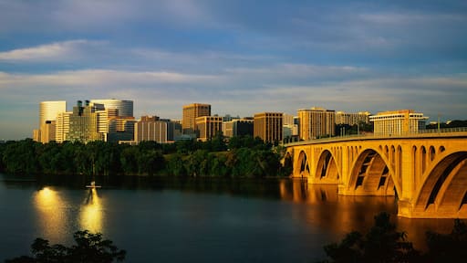 This shows sunrise over the Key Bridge on the Potomac River. The skyline of Rosslyn, Virginia is in the background.