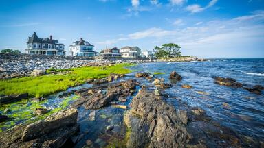 Rocky coast and beachfront homes at Concord Point, in Rye, New H