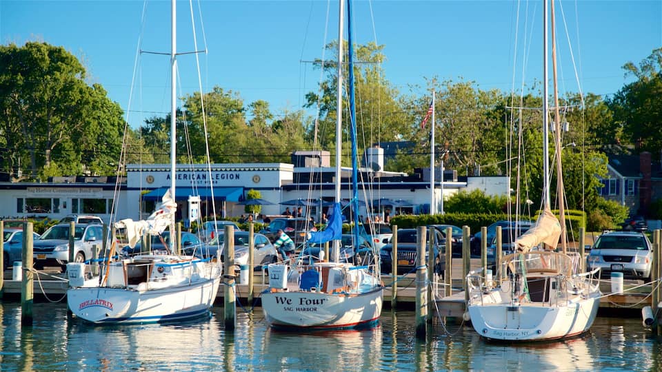 A marina with several boats docked, a community bandstand, and a restaurant named American Legion.