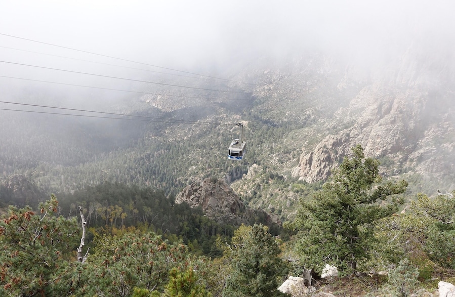Ride the tram up to Sandia Park in Albuquerque, New Mexico to see some spectacular views. 
A major bonus if you do this around hot air balloon festival week and you will see balloons hovering over the city. However the line/queue to ride the tram from the base can be quite long.