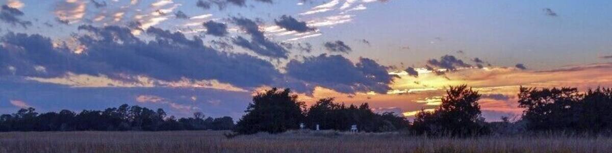Sunset on Sapelo Island, Georgia. Of all of the east coast states of the U.S., Georgia has probably done the best job of preserving the character of its coastline. Several of the islands of the coast, such as Cumberland, St. Catherines, and Sapelo (pictured) aren't accessible by road or bridge, and mingle almost imperceptibly with the salt marshes around them. Sapelo is home to a University of Georgia research institute that was instrumental in the creation of the academic field of ecology.