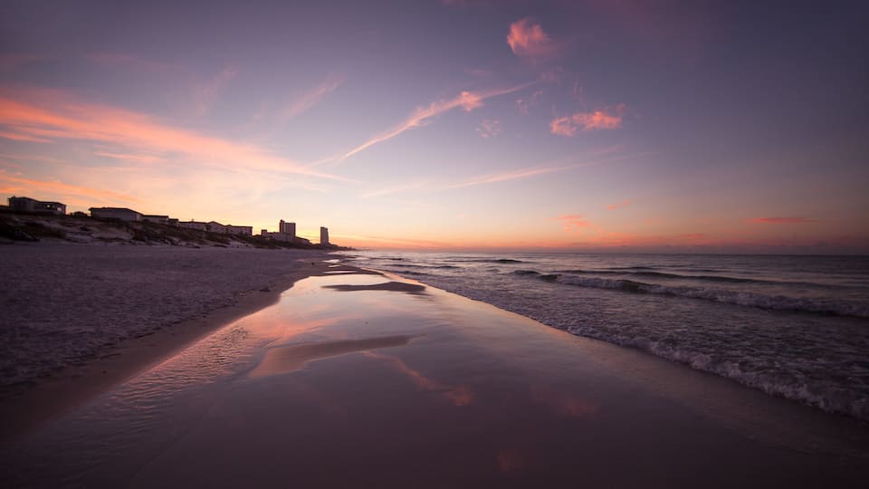 Fort Walton Beach which includes a sunset and a sandy beach