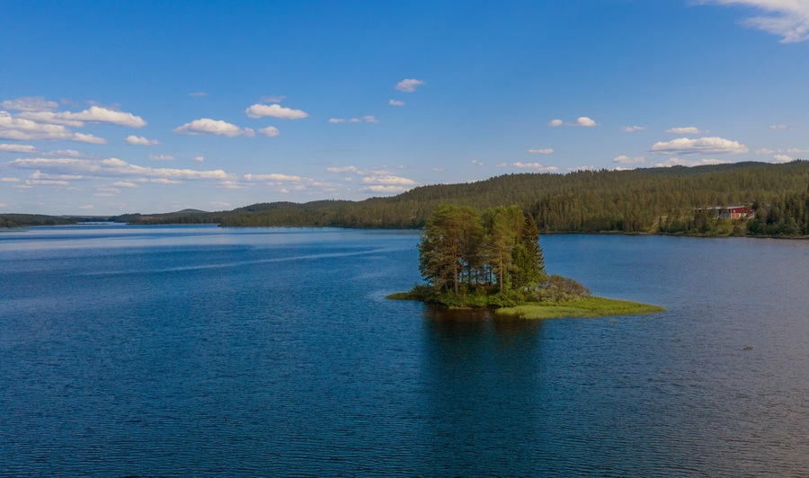 Small island on the Storån-Österdalälven lake in Idre, Sweden. Drone shot, july 2019