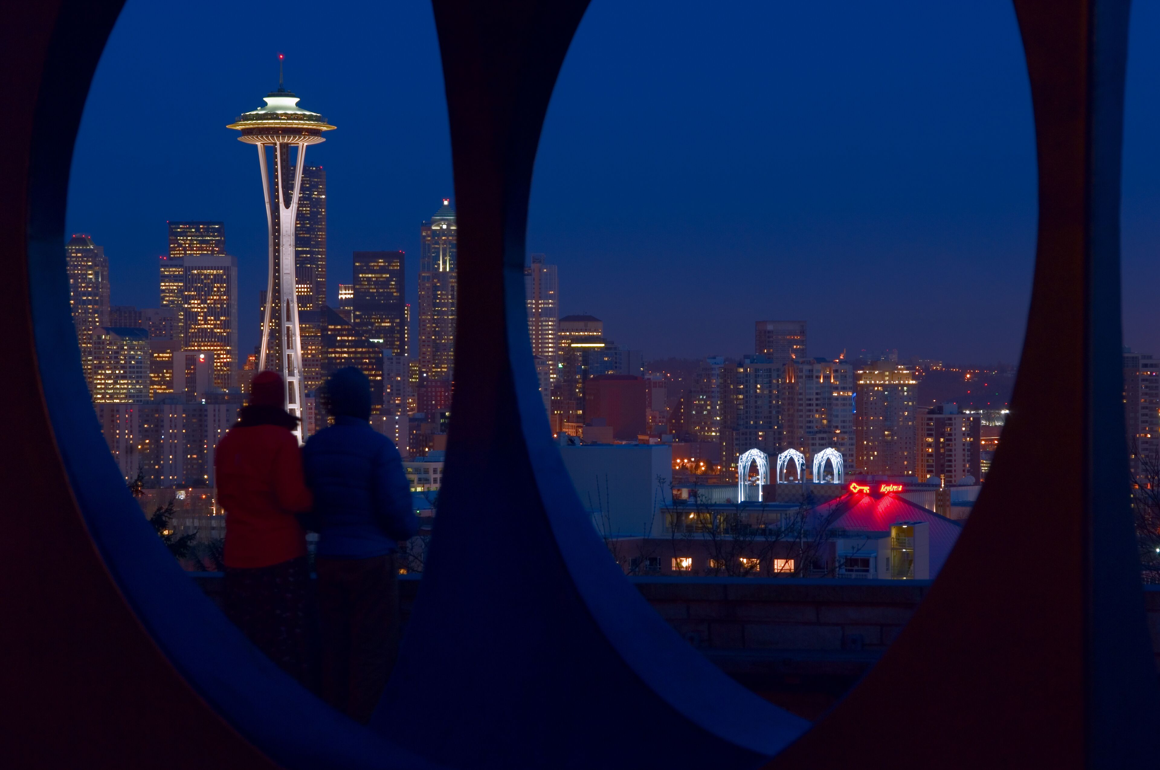 Couple viewing the Seattle Skyline at dusk from Kerry Park
