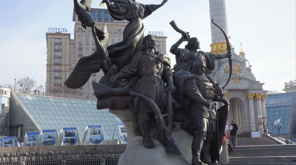 Monument to the Founders of Kiev on Maidan (Independence Square), the central square of Kiev. Since the start of Ukraine's independence movement in 1990, the square has been the traditional place for political rallies and protest campaigns.
The roof of the hotel on the background was one of the locations where snipers were shooting at protesters during “Euromaidan” (February 2014).
