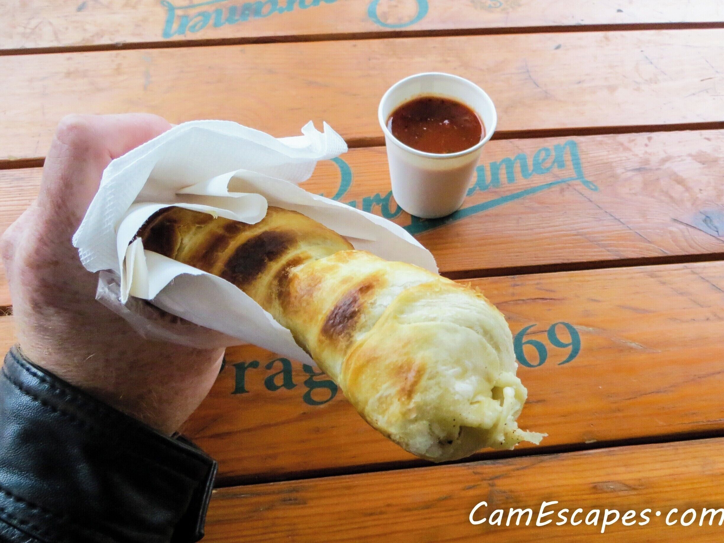 St. Georgia:

Georgian street food. This was a first for me and I loved it. Here they prepare a Georgian specialty called khachapuri. These meat and cheese wraps are similar to a gyro or dönör except the ingredients are baked inside the bread.

Order whatever is freshest. My personal favorite is pictured here with chicken and cheese. 

Make sure to ask for the additional Georgian sauce called tkemali. It’s made from plums, herbs and spices. Ketchup would be the closest thing I could compare it to but it’s much better.

For around $1.50 - $2 these are another great deal in Kiev. Highly recommended.

For more of my favorite street food finds in Kiev and all over Europe check out:

http://www.camescapes.com/street-food-in-kiev-ukraine/

#streetfood #Kiev #Ukraine 