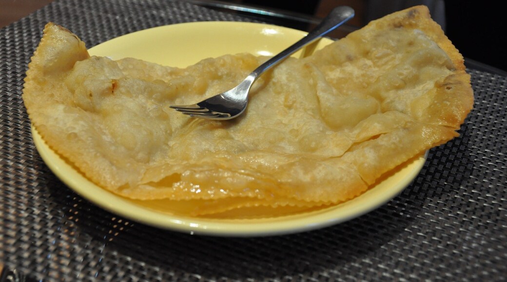 This is a cheburek. It's very thin fried dough with meat and sour cream and maybe some greens spread in the middle. I'm not a huge fan of friend dough, so I'd rather go with the shwarma offered by this little café, but I had to give cheburek a try since I'd never heard of it before! This tiny café has a small bar and a handful of tables with bench seats and chairs tucked into its corner location. Or, you can get your food to go.