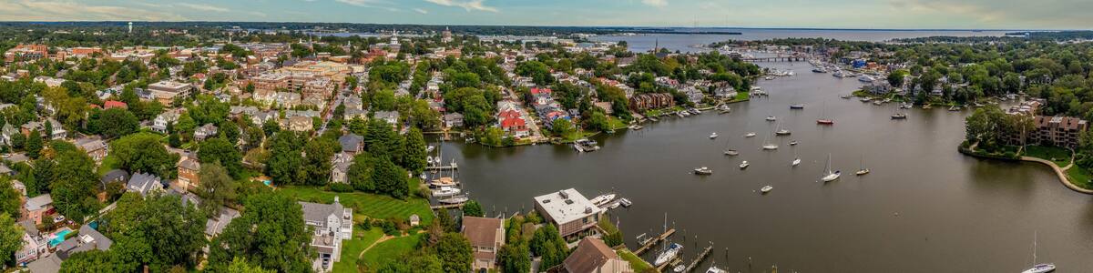 Aerial view of Annapolis capital city of Maryland state with expensive waterside properties along the Chesapeake Bay, state capital building and naval academy, dreamy blue sky