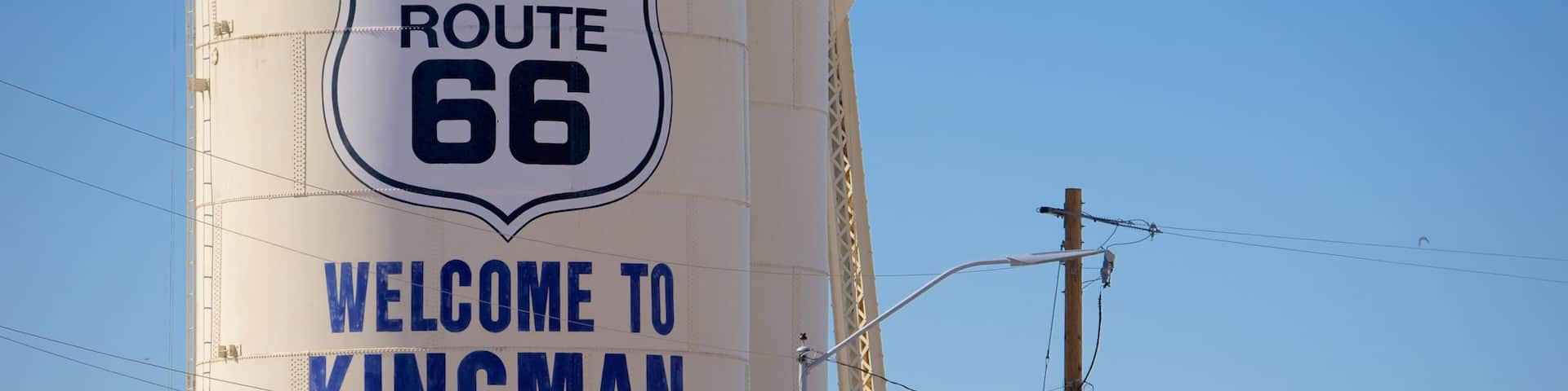 Kingman which includes desert views, signage and tranquil scenes