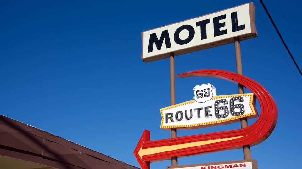 A motel sign with Route 66 and Kingman.