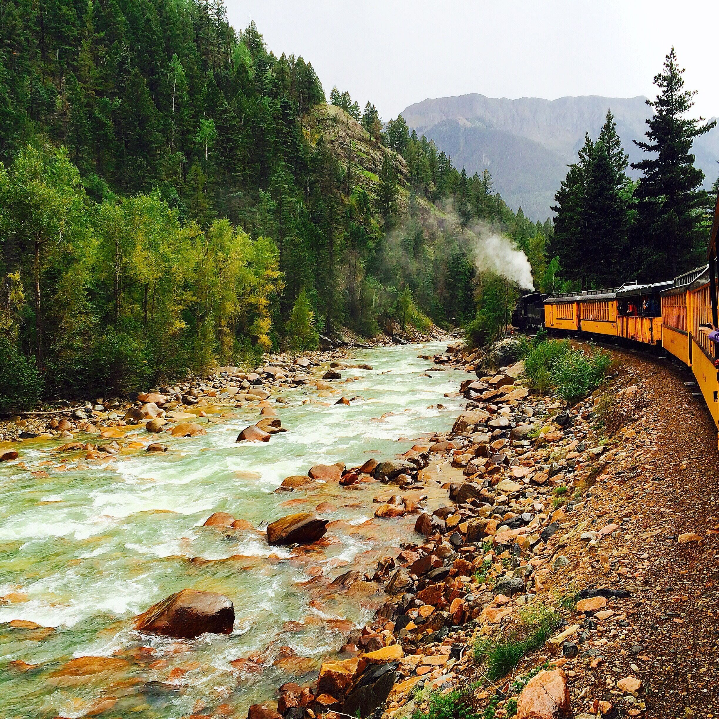 The Silverton to Durango narrow gauge railway cuts through the mountains in Colorado, giving a great view of the forest and river. 