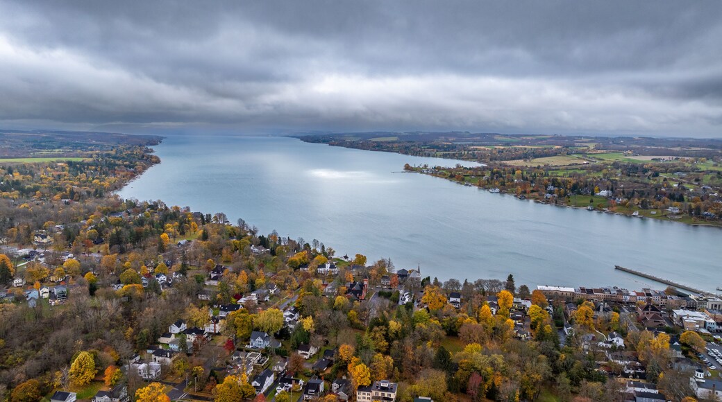 Aerial photo of fall foliage surrounding the Town of Skaneateles, Skaneateles Lake, Onondaga County, New York State, November 2024.