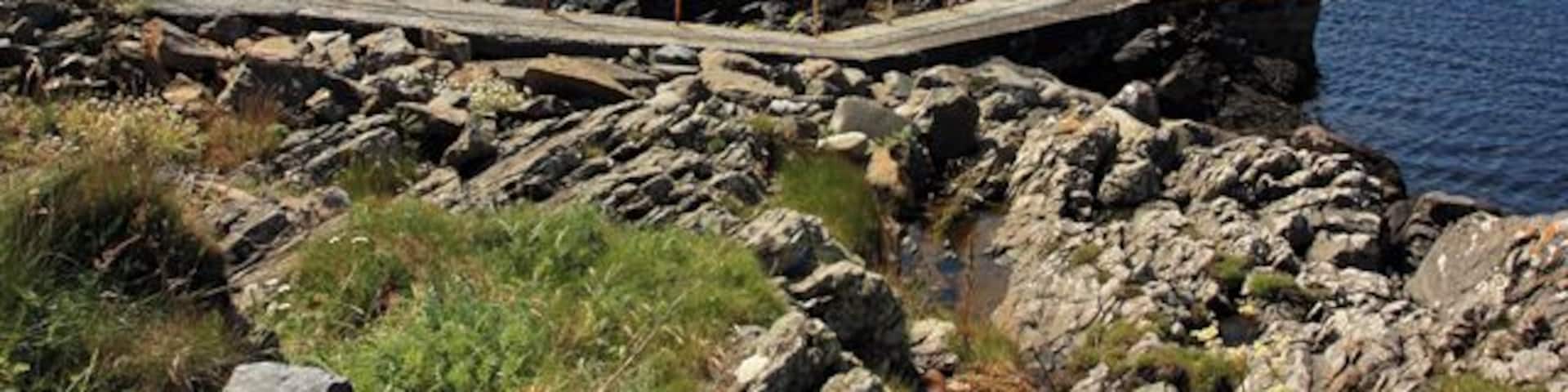 Port Wemyss Pier Across the water is the island of Orsay and the Orsay lighthouse.