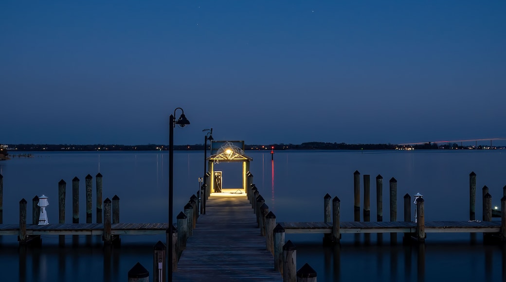 Solomons, Maryland, USA An illuminated pier at night on the Patuxent River.