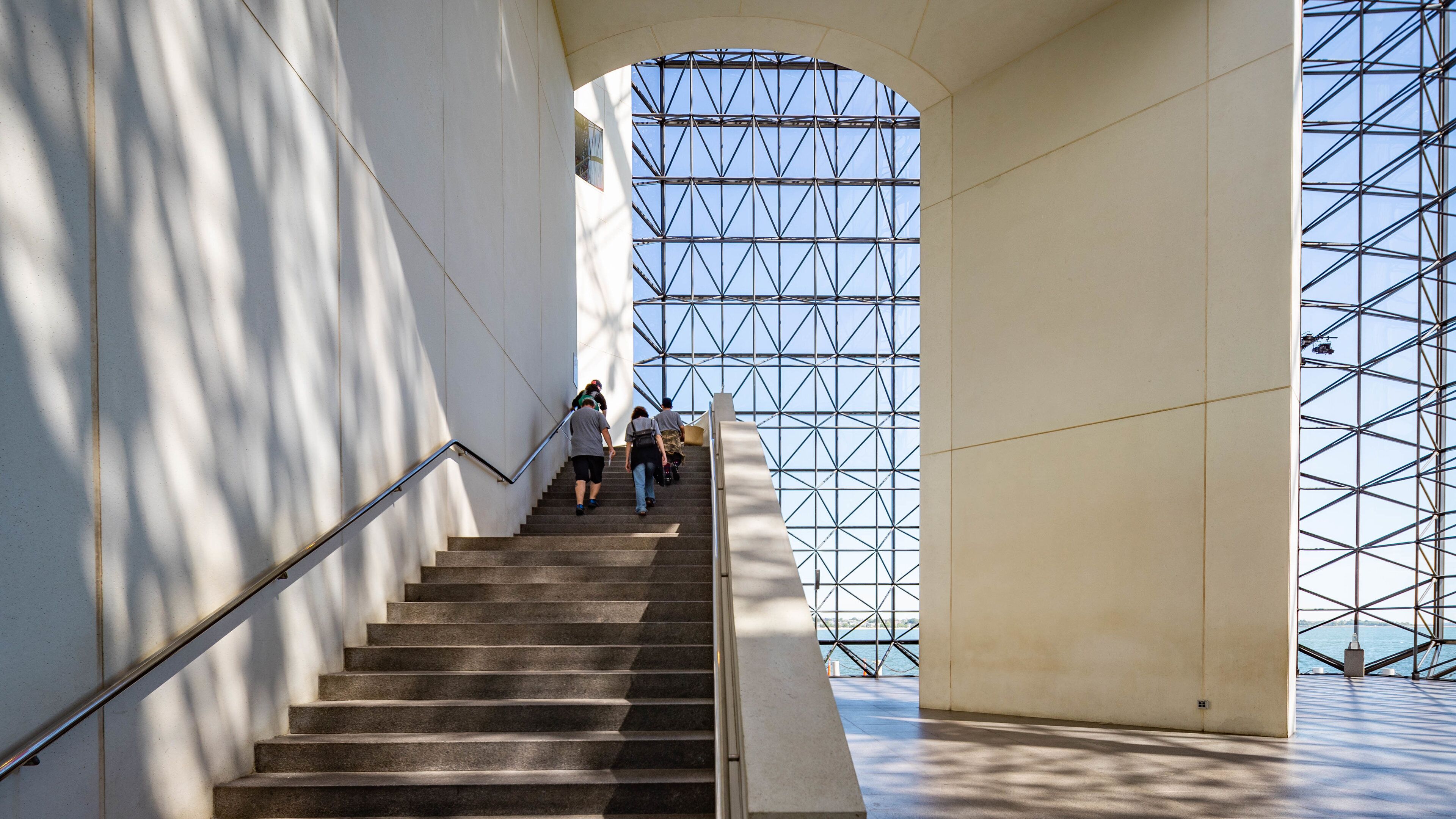 John F Kennedy Presidential Museum Library featuring interior views as well as a small group of people