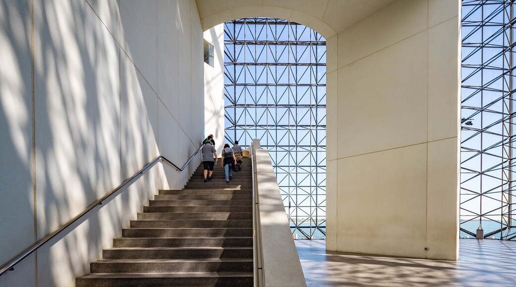 John F Kennedy Presidential Museum Library featuring interior views as well as a small group of people