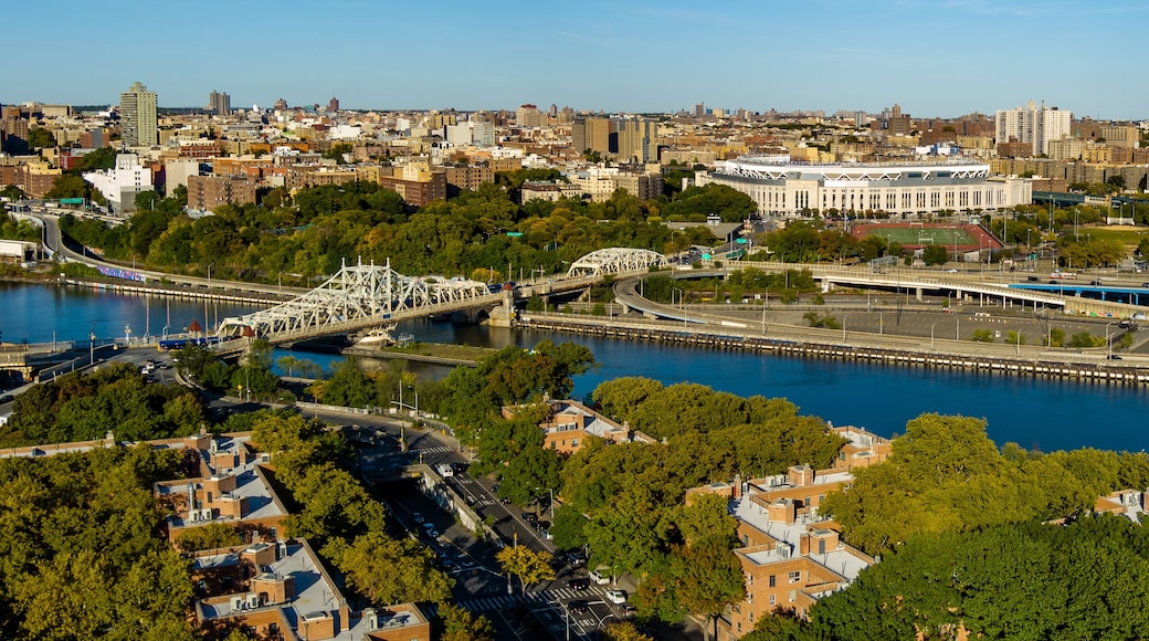 Aerial View of Yankee Stadium, Macombs Dam Bridge & the Harlem River on a sunny day.