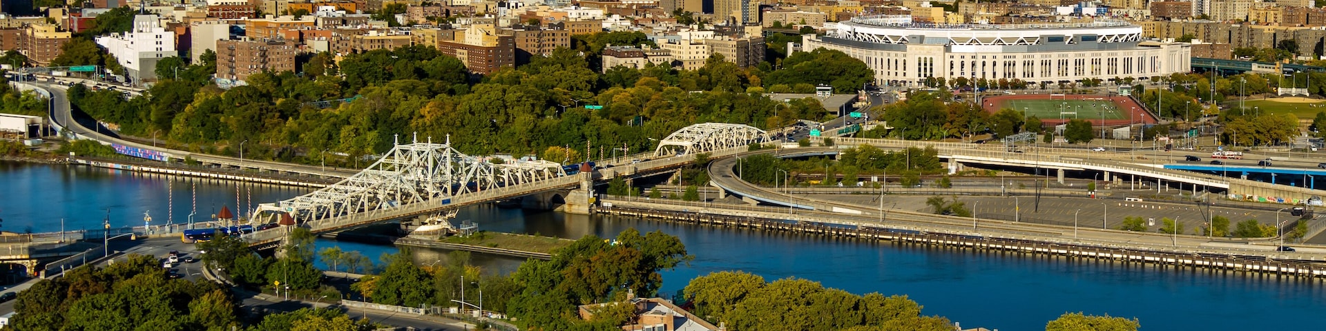 Aerial View of Yankee Stadium, Macombs Dam Bridge & the Harlem River on a sunny day.