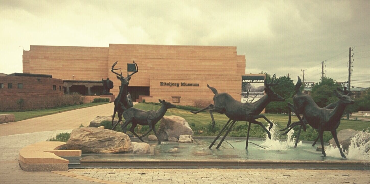 Figures of fleeing dear in front of the Eiteljorg Museum of American Indians and Western Art.