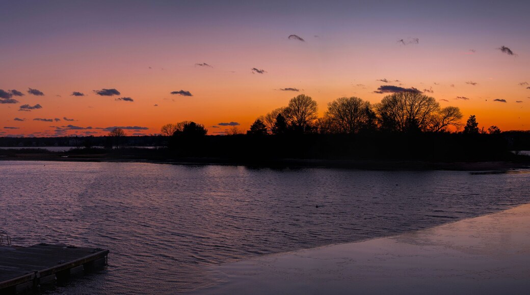 Seascape at Sunset over the Buzzard Bay in Dartmouth, Massachusetts, USA: A vibrant panoramic winter evening landscape of New England of America