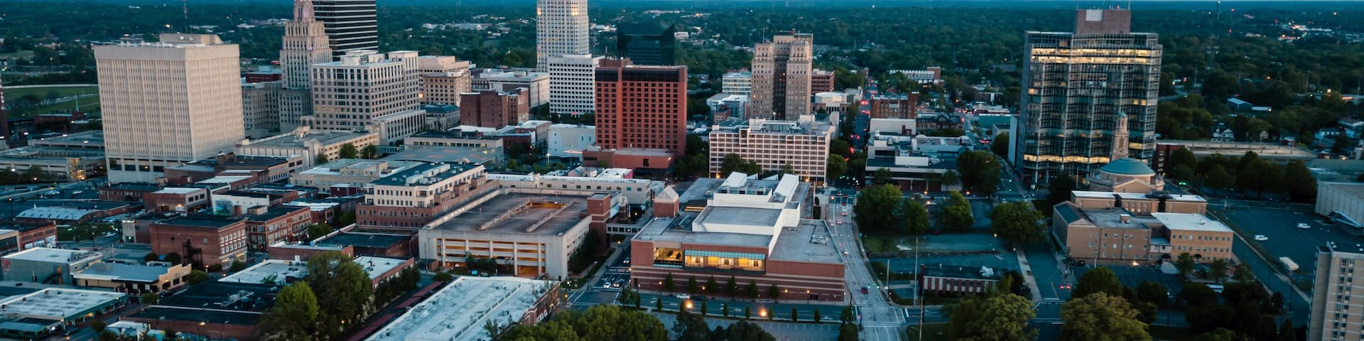 Aerial View as Night Falls on the Downtown City Skyline at Winston-Salem