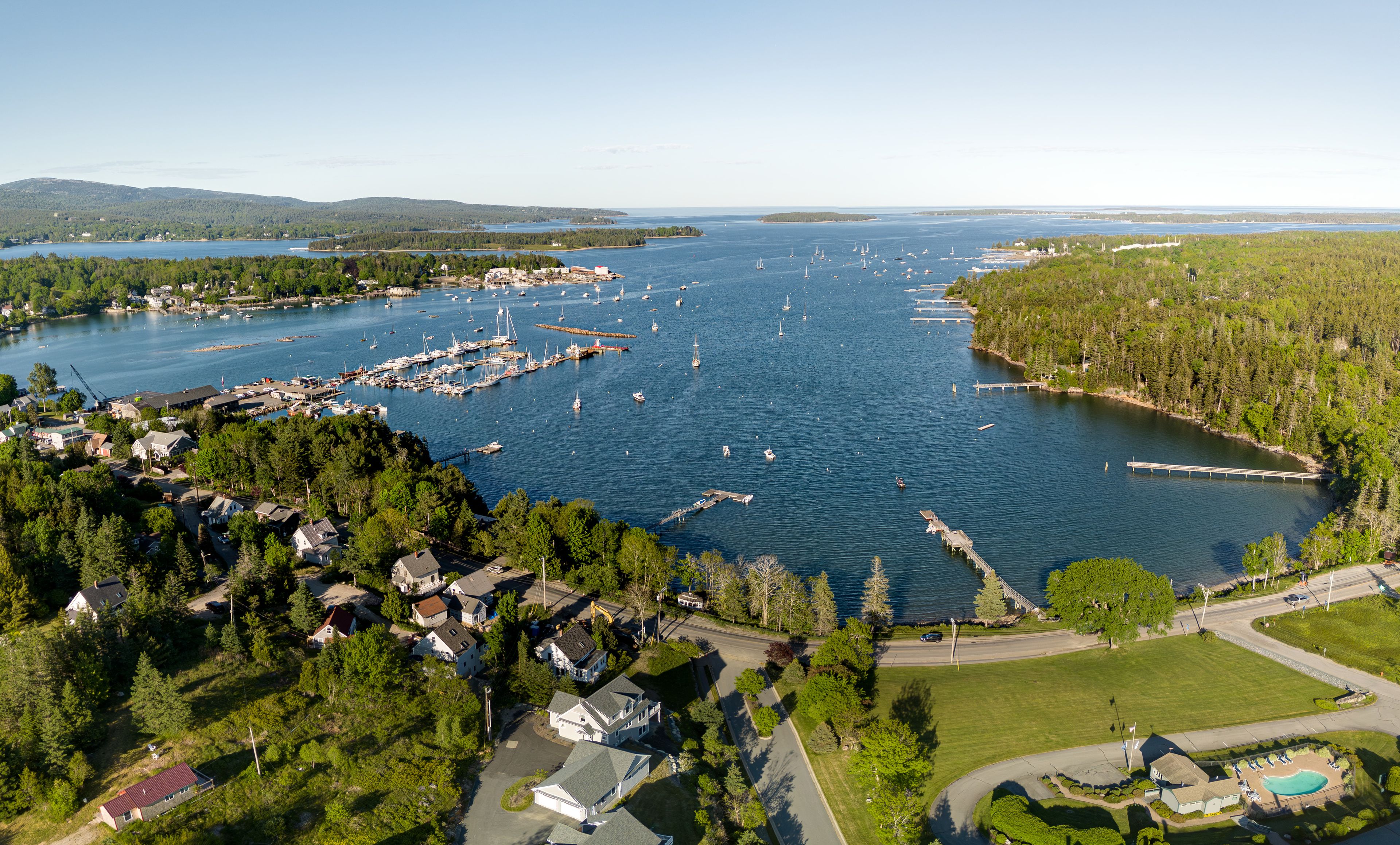 An aerial view of the scenic harbor and coastline in Southwest Harbor, Maine, USA.  June 1, 2024. 