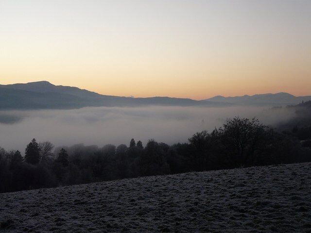 Balnalurigin Sunset Freezing fog in Glen Urquhart just after sunset with the Glen Affric Hills prominent in the distance. Taken from the holiday cottage at Balnalurigin.