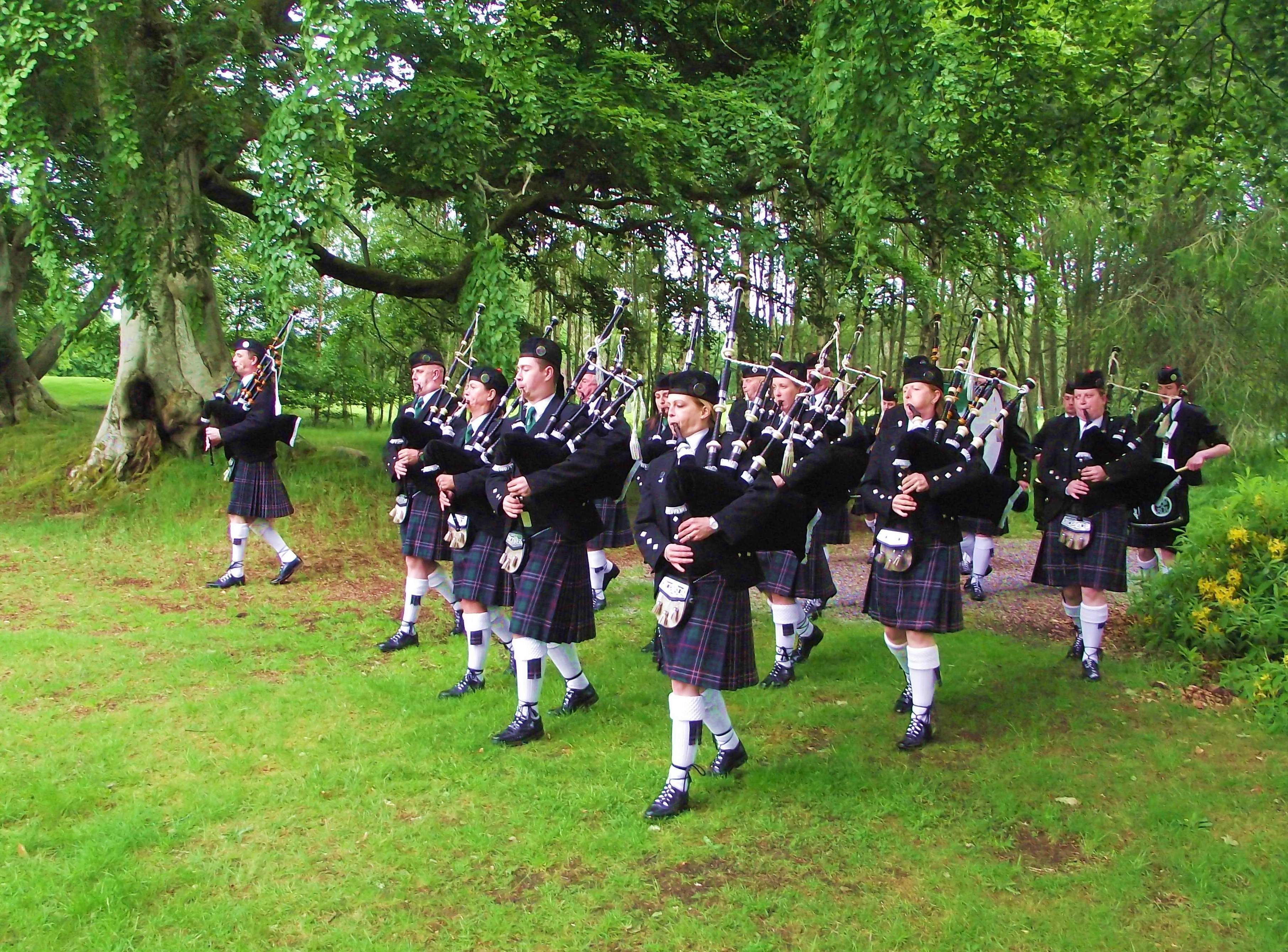 Pipe Major Steve spencer leads the Band out of the avenue on to the lawn in front of the Castle. NORTHERN CONSTABULARY Community Pipe Band www.facebook.com/pages/NorCon-PipeBand/1385366948451393 performed at Aldourie Castle on Loch Ness-side last evening. It was a lovely evening in a lovely setting, but the light wasn't very good.