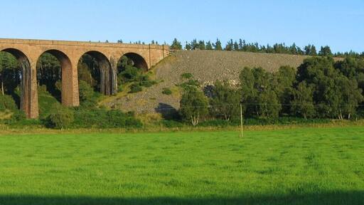 Panoramic view of Culloden Viaduct (also known as Nairn viaduct) with a Scotrail train on the Highland Line on it. This double-track viaduct is the longest (1800ft (549m)) masonry railway viaduct in Scotland. It was opened in 1898. Panoramic image created with programs hugin and enblend.