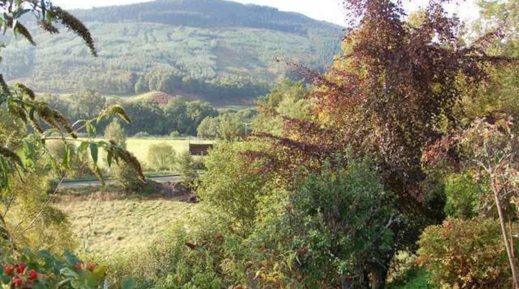 Milton. View from the village over the A831 to the flood plain of the Enrick.