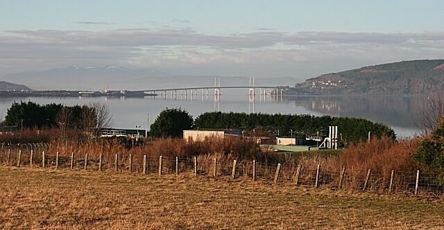 Allanfearn How to ruin a fine view - build a sewage treatment plant in the foreground. This is the sewage works at Allanfearn, taken from just below the level crossing.