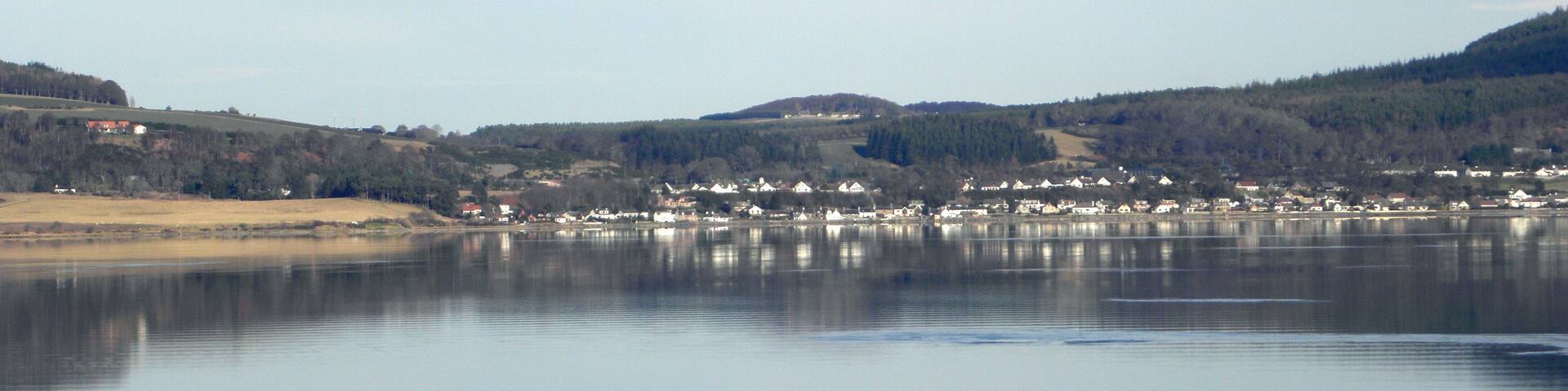 Hay rolls and the Beauly Firth This is a view over Bunchrew (Bun Chraoibh ) Bay and Beauly Firth (Linne Fharair, Poll an Ròid or Caolas Uisge a' Mhanachainn ) towards Redcastle on the Black Isle (an t-Eilean Dubh )