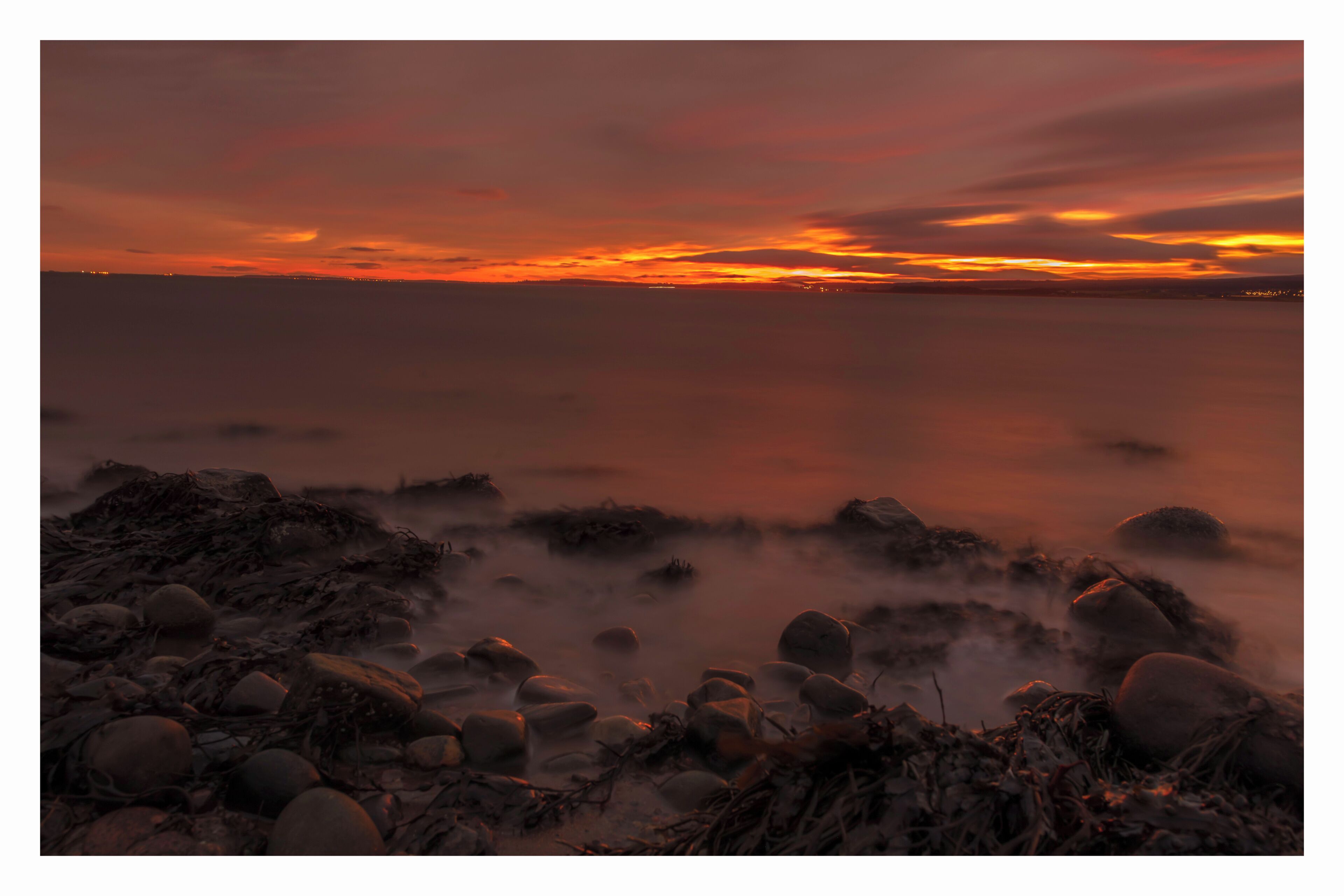 a stormy start to the weekend, with a fiery sky to warn of the storms ahead.

Kilmuir is a point near Inverness that offers brilliant southward views of the firth and westward to the Kessock Bridge over the Great Glen fault.