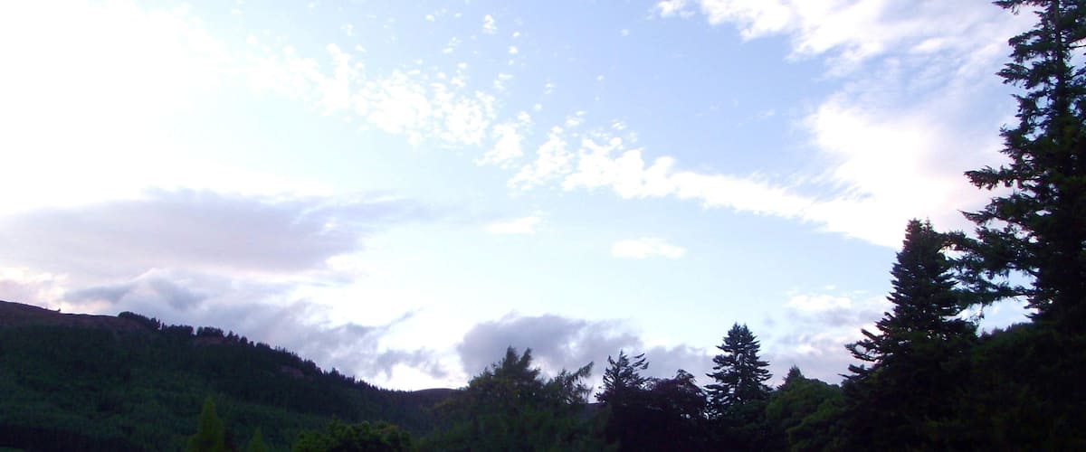 1,000 views on 20th December 2013 The Band performing on the Castle lawn - sadly the light was fading but what a sky! That's Loch Ness visible through the tress. Northern Constabulary Community Pipe Band fulfilled another engagement at Aldourie Castle, overlooking Loch Ness, on the evening of Thursday 15th August 2013. The sun was already low in the sky, behind the mountains, by the time our performance time arrived - but it was a beautiful evening. A hint of rain had gone and a slight breeze helped to keep the worse of the midges away. The Mini-Band, comprising 6 pipers and 4 drummers, played down the side of the castle on the lawn overlooking the Loch, and then formed up in a semi-circle in front of the Castle's viewing area to entertain the guests. Meanwhile the sky was producing its own beautiful performance in harmony with the Band! The Castle and its Estate is truly an idyllic and tranquil setting. "Nestling on the quiet southern shore of the famous Loch Ness, close to the City of Inverness, the capital of the Scottish Highlands, Aldourie Castle Estate offers you a rare taste of Highland living at its best." Please visit www.aldouriecastle.co.uk/ for lots more fascinating information about the Castle and its Estate.