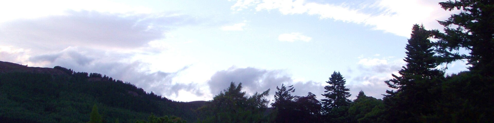1,000 views on 20th December 2013 The Band performing on the Castle lawn - sadly the light was fading but what a sky! That's Loch Ness visible through the tress. Northern Constabulary Community Pipe Band fulfilled another engagement at Aldourie Castle, overlooking Loch Ness, on the evening of Thursday 15th August 2013. The sun was already low in the sky, behind the mountains, by the time our performance time arrived - but it was a beautiful evening. A hint of rain had gone and a slight breeze helped to keep the worse of the midges away. The Mini-Band, comprising 6 pipers and 4 drummers, played down the side of the castle on the lawn overlooking the Loch, and then formed up in a semi-circle in front of the Castle's viewing area to entertain the guests. Meanwhile the sky was producing its own beautiful performance in harmony with the Band! The Castle and its Estate is truly an idyllic and tranquil setting. "Nestling on the quiet southern shore of the famous Loch Ness, close to the City of Inverness, the capital of the Scottish Highlands, Aldourie Castle Estate offers you a rare taste of Highland living at its best." Please visit www.aldouriecastle.co.uk/ for lots more fascinating information about the Castle and its Estate.