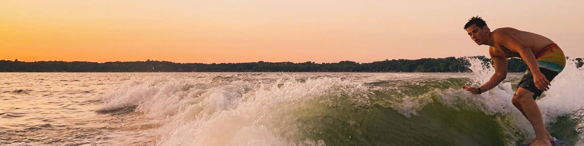 A sunset surf-sesh is a special way to enjoy summer nights at the lake! #Adventure