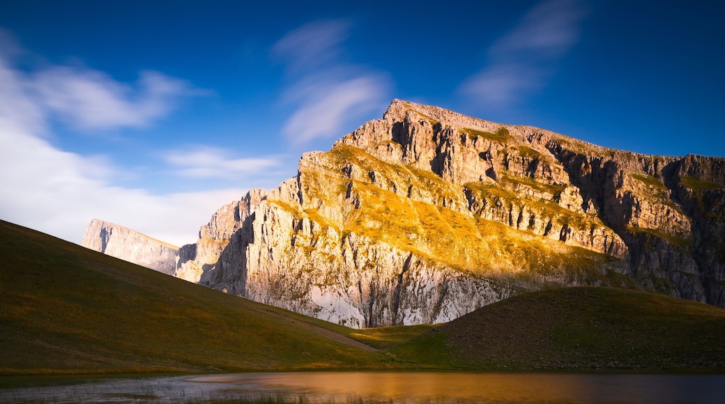 Golden sunlight hitting the peaks above the dragon lake in northern Greece. It's a moderately steep hike of about 3 hours to the refuge (where you can sleep and order food) and then another hour to this lake. We had the place to ourselves the entire evening. It was magical! #golden