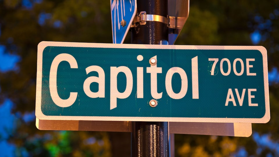 A street sign for Capitol 700E Ave.