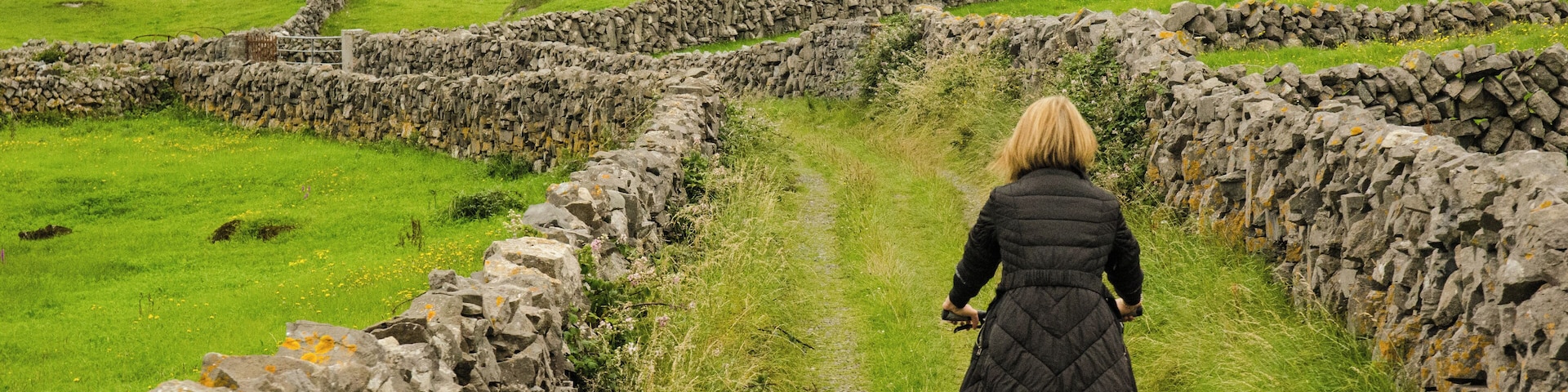 Ireland, Aran Islands, Inishmore, Zigzagging.
Zigzagging the way trough the green Ireland fields and limestone walls where bicycle serves better than a car. 
#LifeAtExpedia