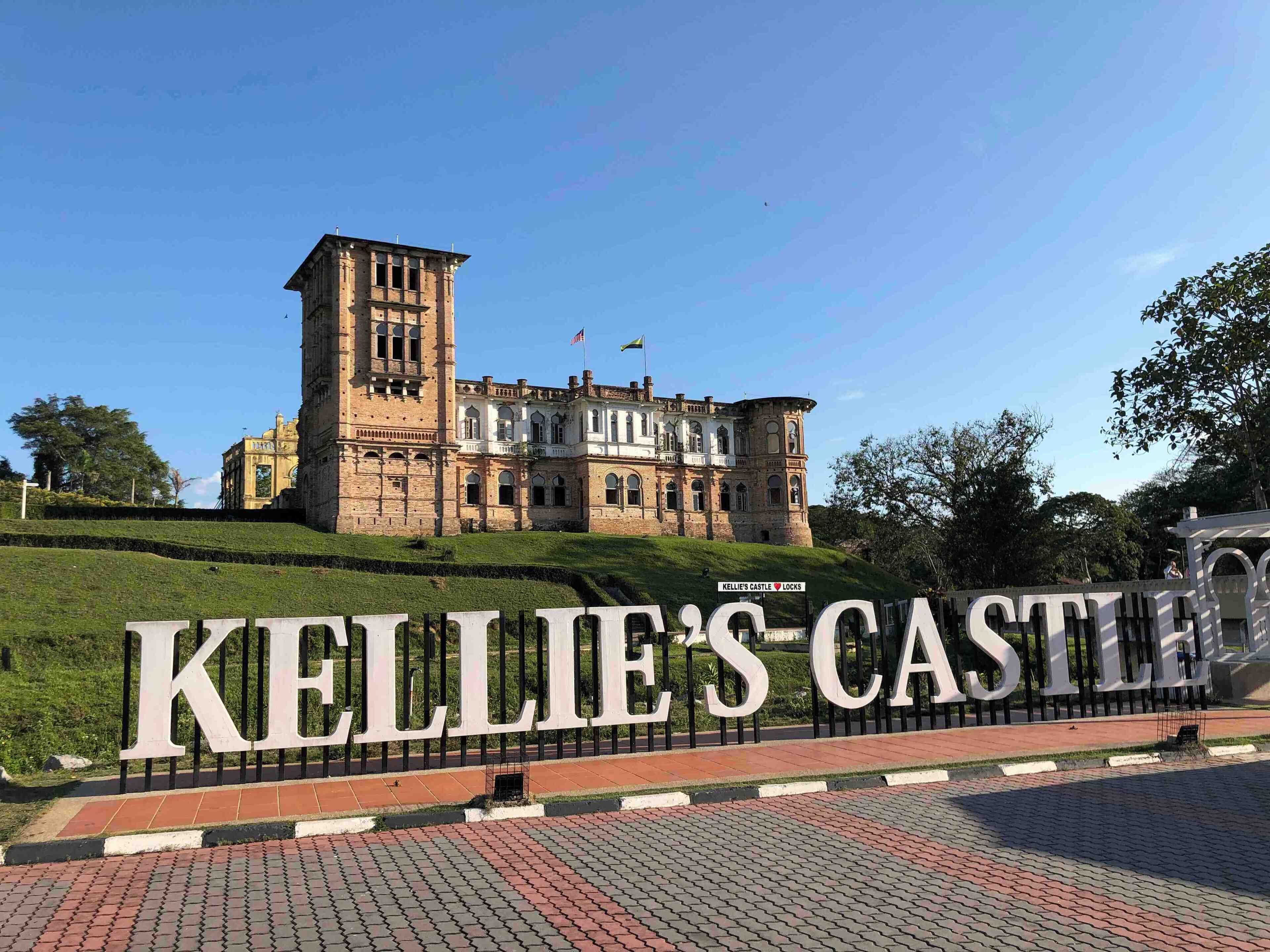 Kellie's Castle with a large sign in front.