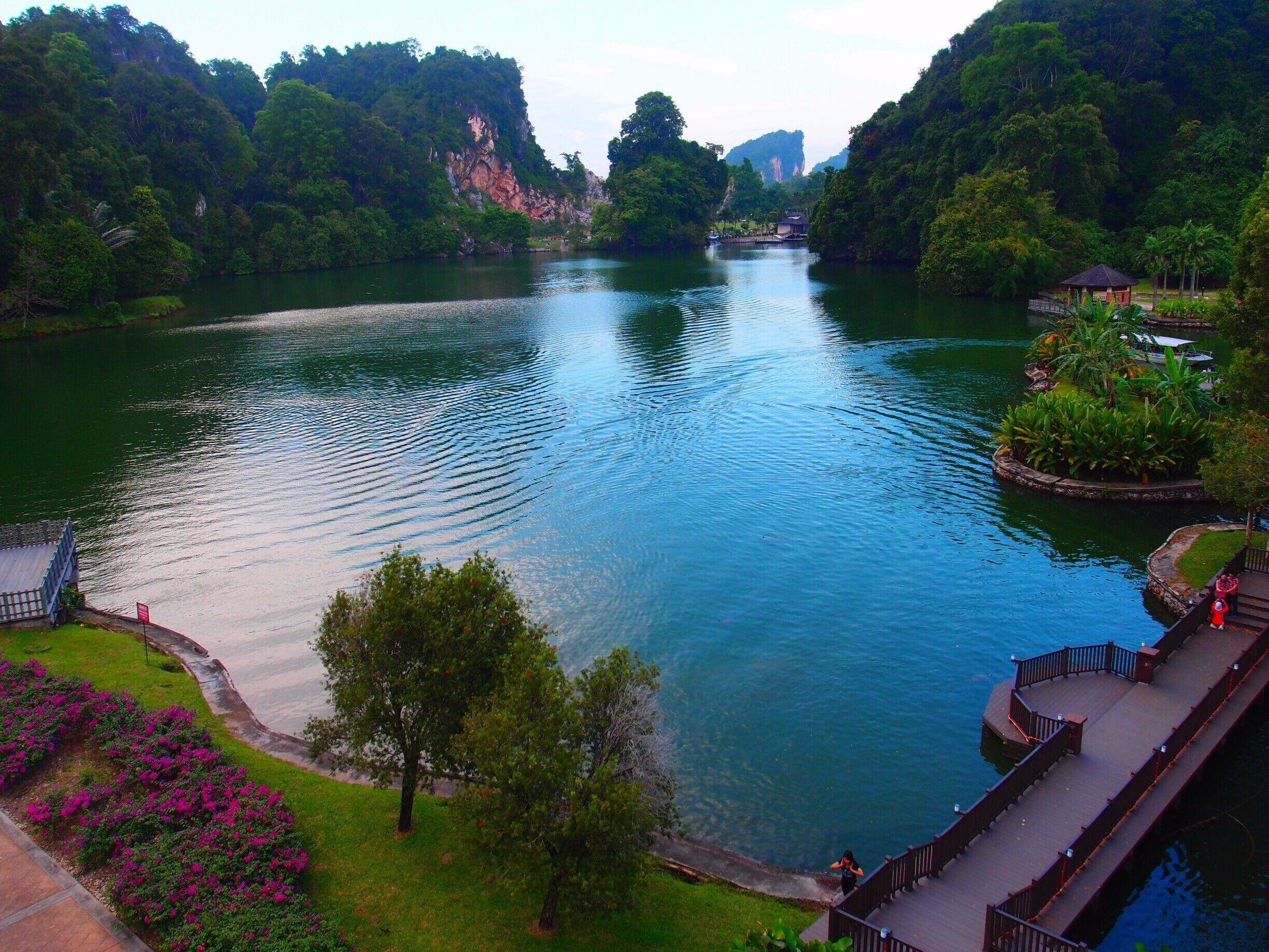 A relaxing place to appreciate nature. You are going to take a small boat to cross the lake to the other end. There you can relax on the native Malay houses, enjoy the playground and there is a mini zoo also. There are trees and shady areas to have picnic. The boat will cross back and forth to pick up the visitors every 30mins more or less so you don't need to worry on the ride back. There are fishes and turtles you can feed on the side of the lake for the kids to have fun.