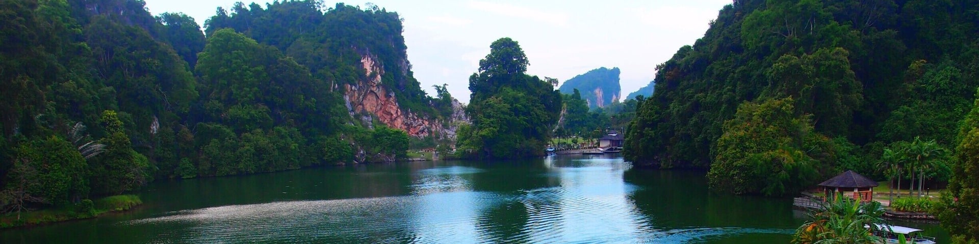 A relaxing place to appreciate nature. You are going to take a small boat to cross the lake to the other end. There you can relax on the native Malay houses, enjoy the playground and there is a mini zoo also. There are trees and shady areas to have picnic. The boat will cross back and forth to pick up the visitors every 30mins more or less so you don't need to worry on the ride back. There are fishes and turtles you can feed on the side of the lake for the kids to have fun.