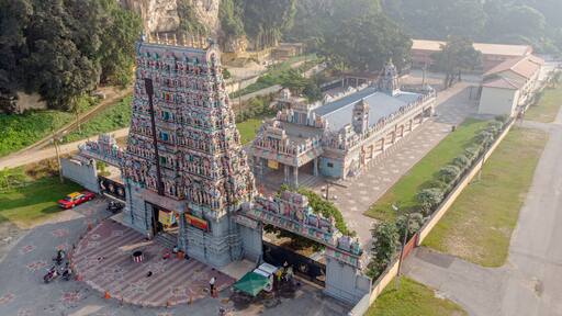 Aerial view of Kallumalai Arulmigu Subramaniyar Temple, a Hindu temple beside a limestone hill in Ipoh city, Malaysia.